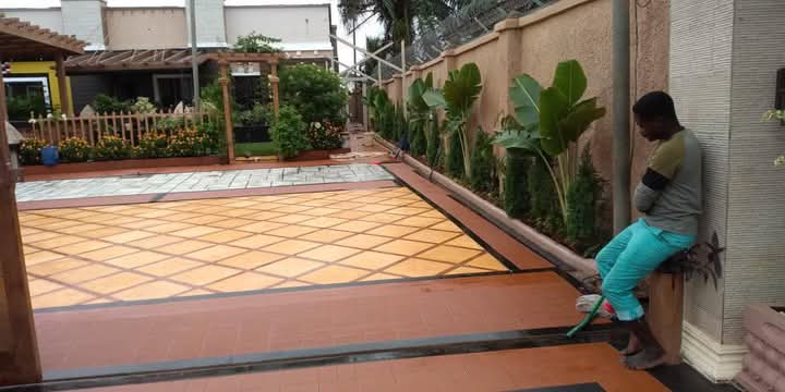 Terracotta and black tile paving